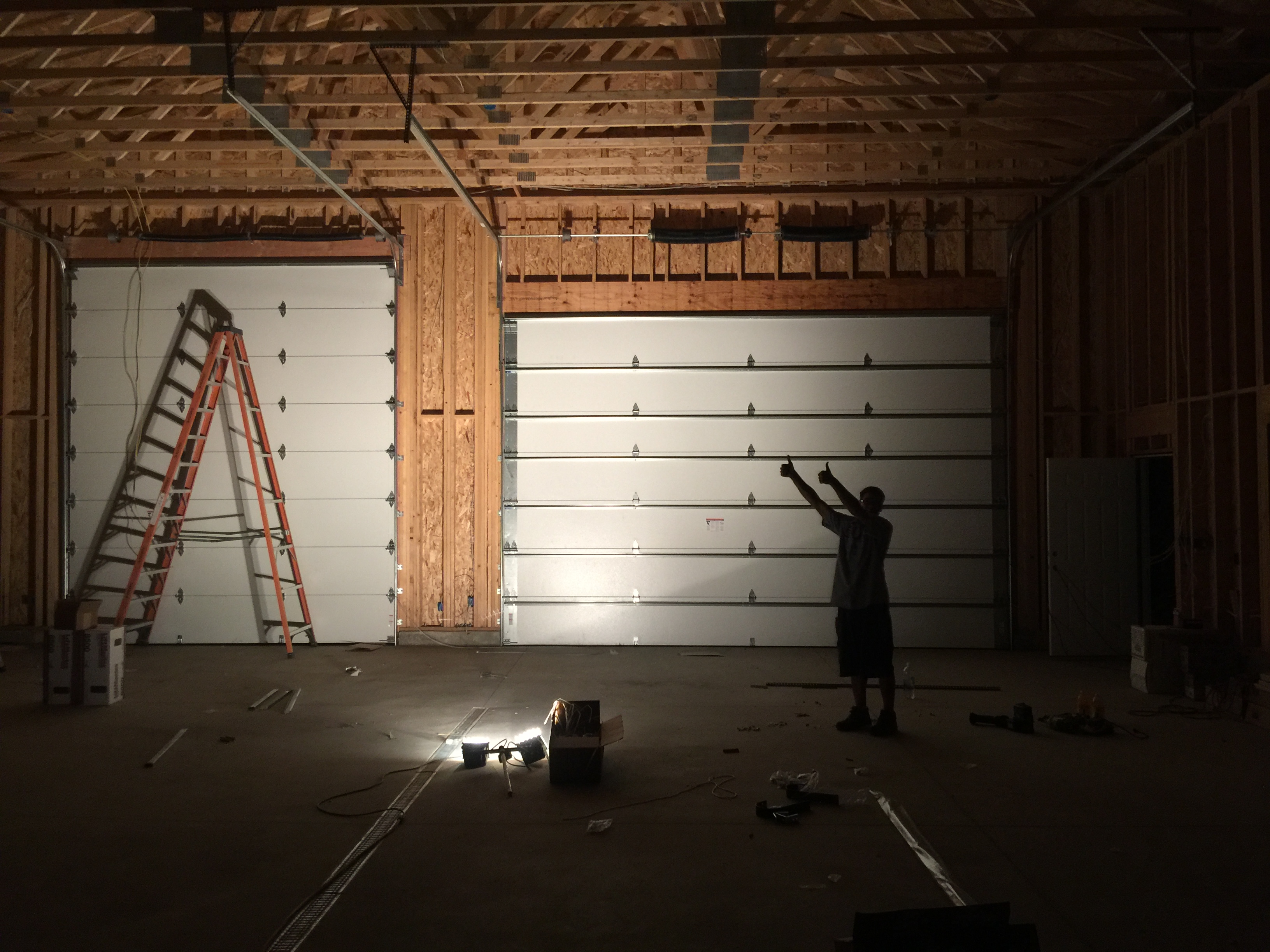 Man standing in front of garage